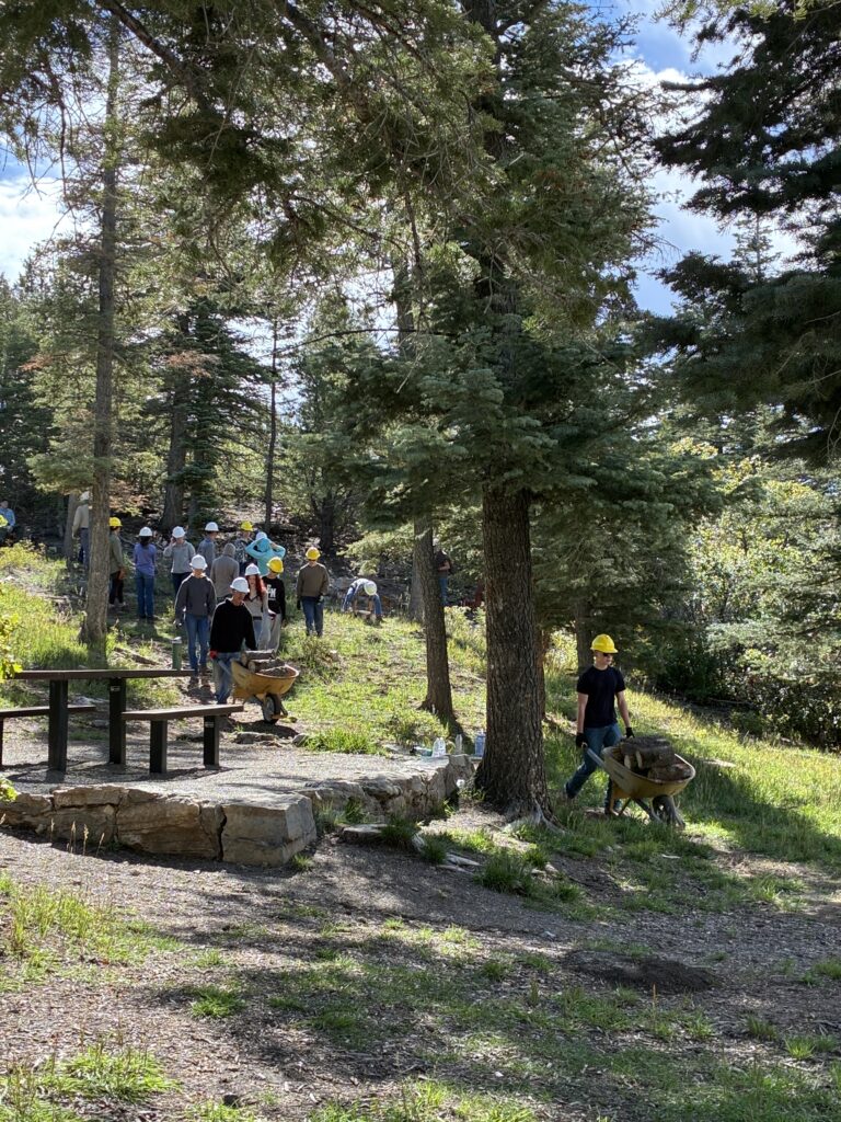 20261007 1105 Students hauling wood down from 3rd location